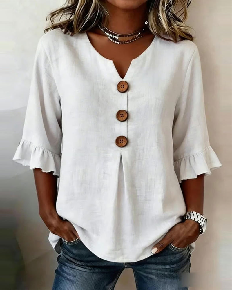 Sofía | Blusa de algodón-lino lisa con botones de madera y volantes