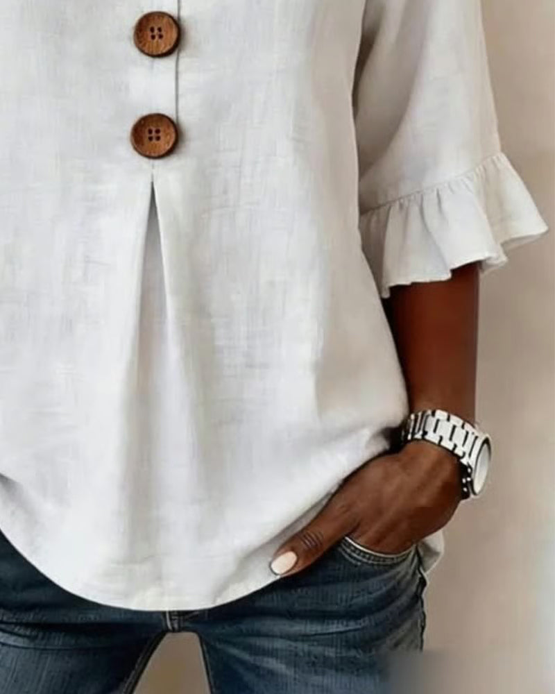 Sofía | Blusa de algodón-lino lisa con botones de madera y volantes