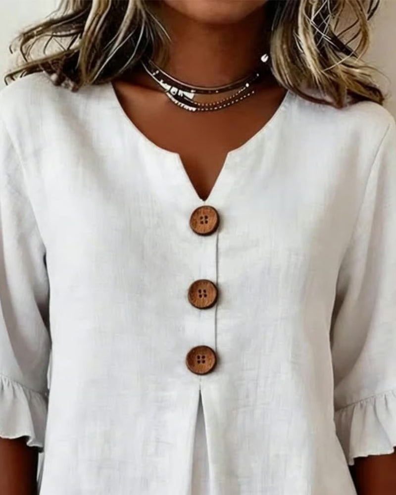 Sofía | Blusa de algodón-lino lisa con botones de madera y volantes