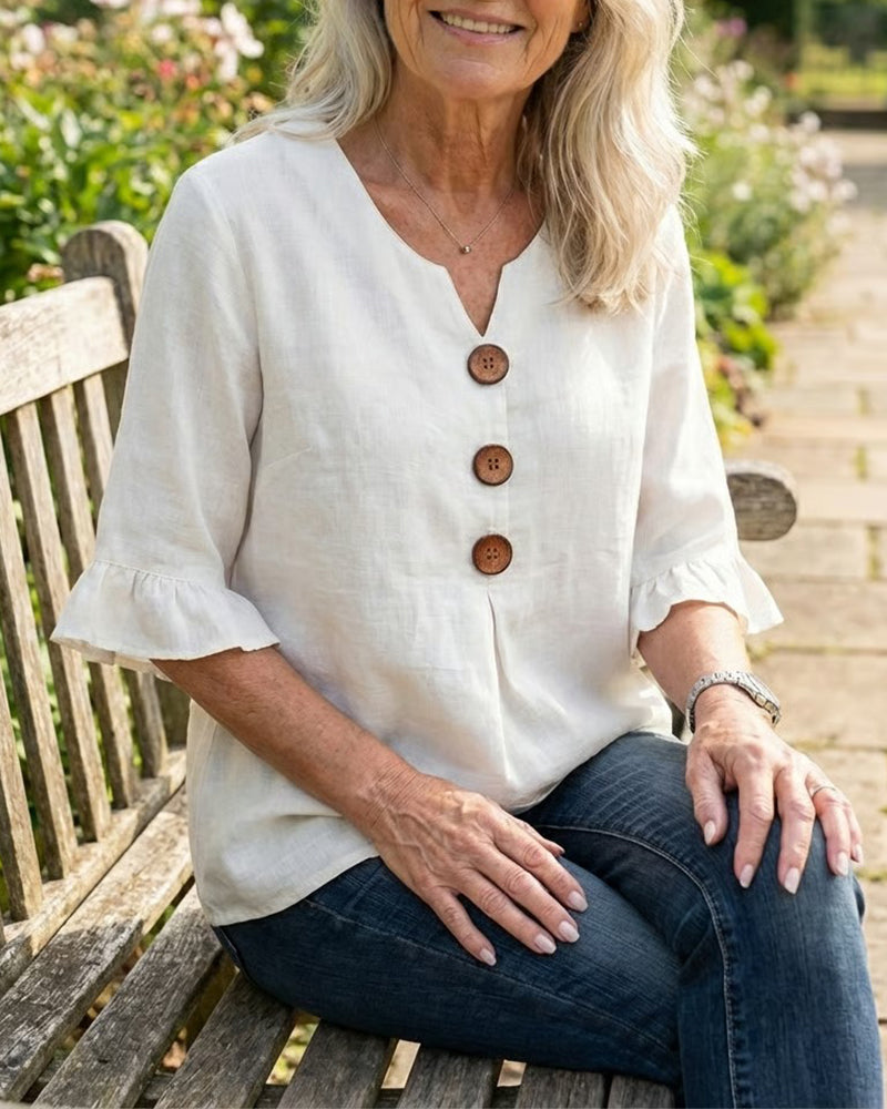 Sofía | Blusa de algodón-lino lisa con botones de madera y volantes