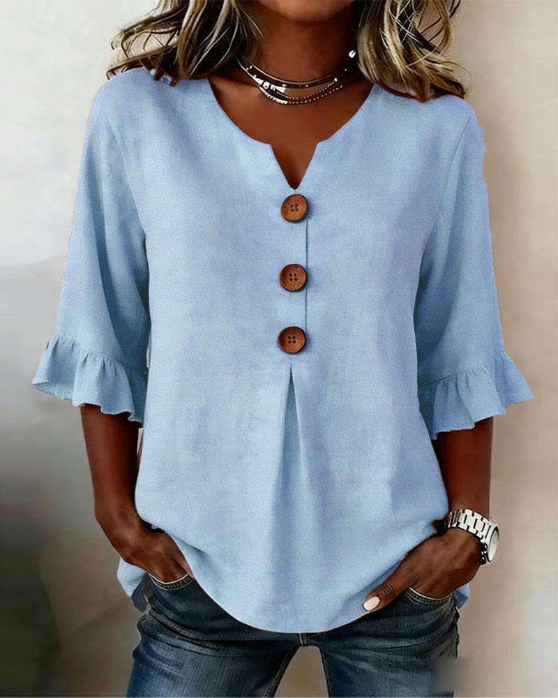 Sofía | Blusa de algodón-lino lisa con botones de madera y volantes