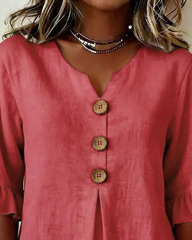 Sofía | Blusa de algodón-lino lisa con botones de madera y volantes