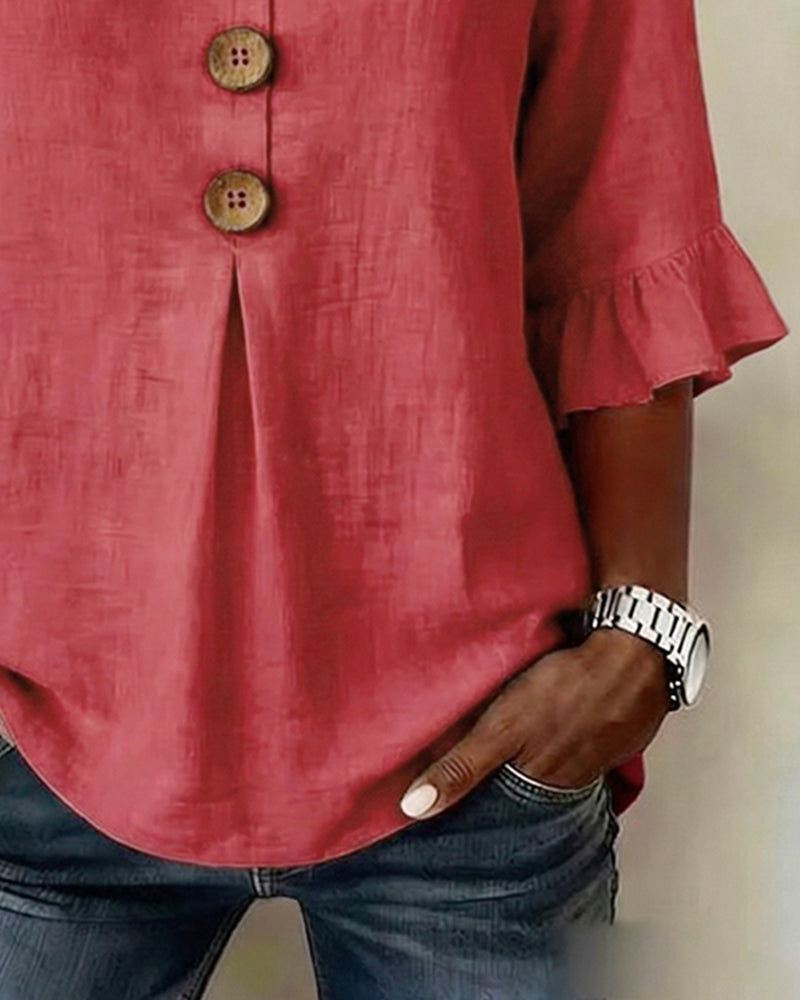 Sofía | Blusa de algodón-lino lisa con botones de madera y volantes