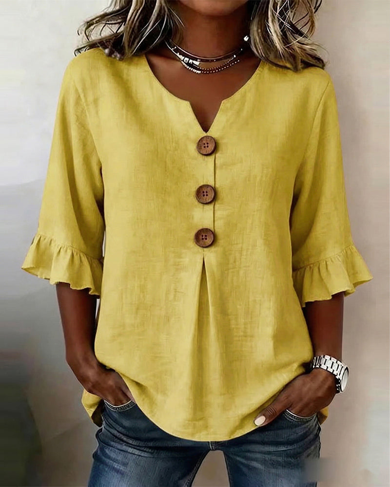 Sofía | Blusa de algodón-lino lisa con botones de madera y volantes
