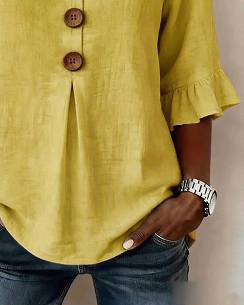 Sofía | Blusa de algodón-lino lisa con botones de madera y volantes